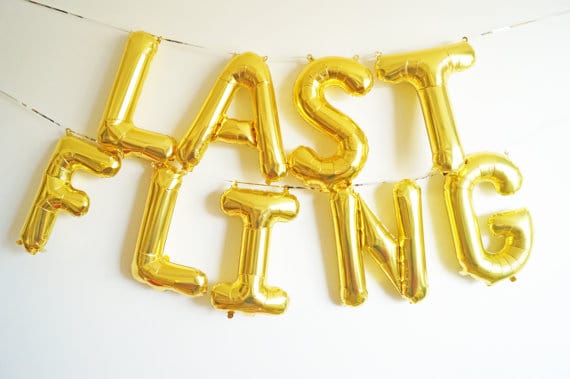 Gold foil letter balloons spelling LAST FLING