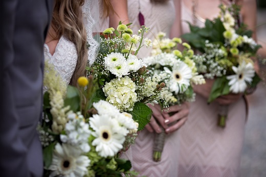 White flower bridal bouquets with green foliage
