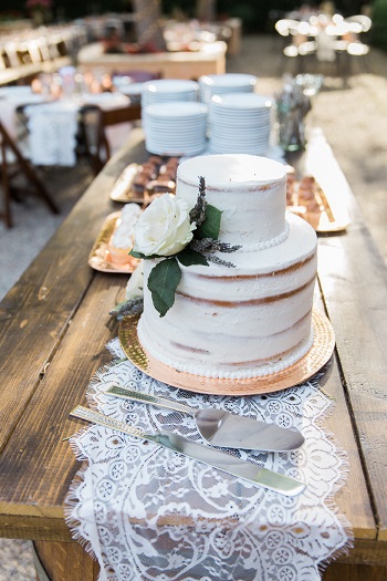 2 tier lightly iced wedding cake created by Your Cake Baker