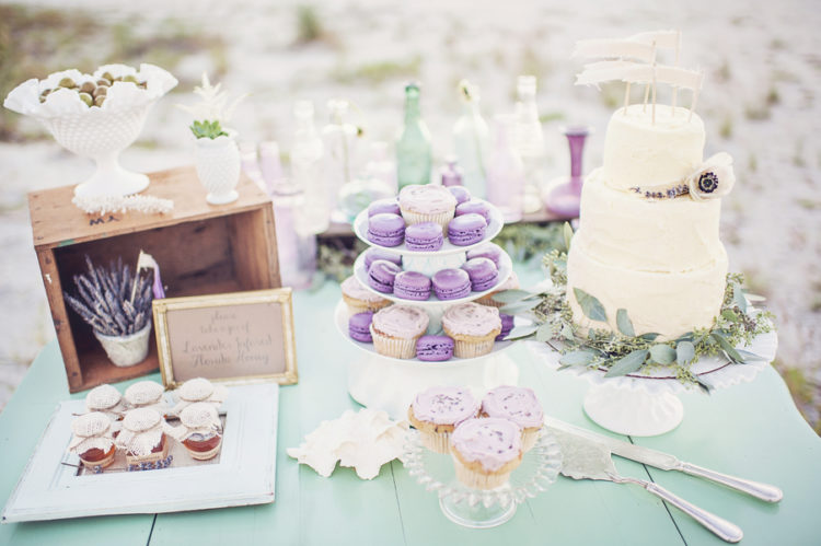 lavender macaroons and desserts on table