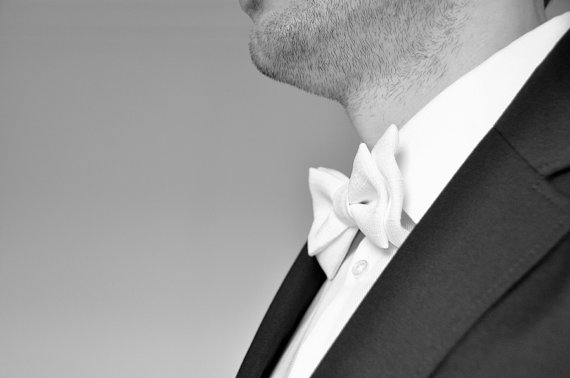 groom wearing formal White Bow Tie