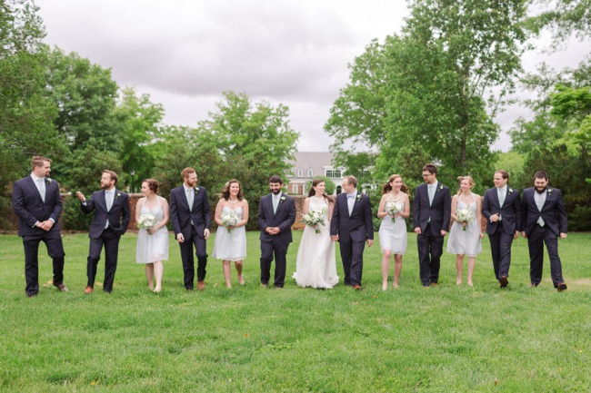 bridal party in a row on grass