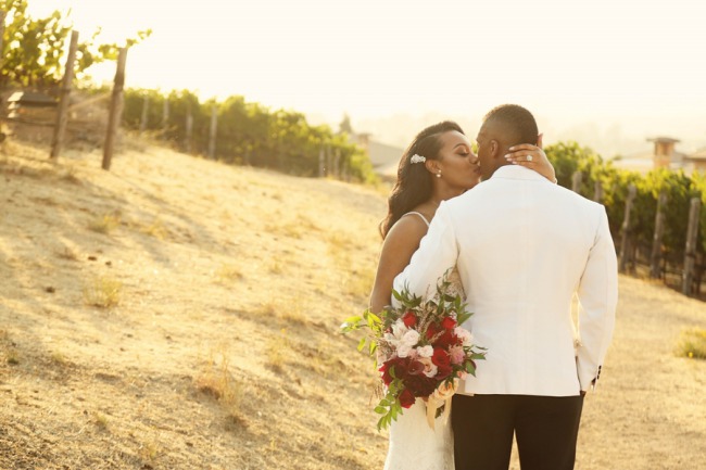 newlyweds among vines at Meritage vineyard