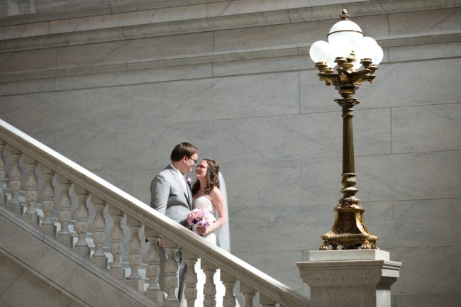 newlyweds on staircase with lamp