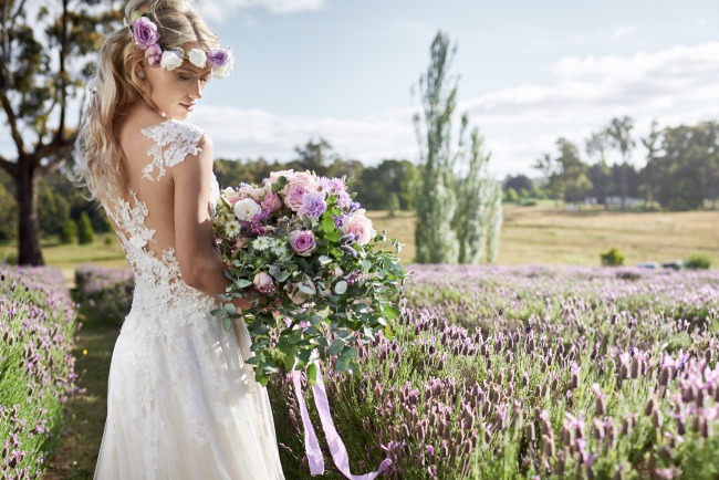 styled bride with bouquet in lavender field
