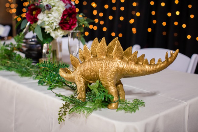 gold stegosaurus on table
