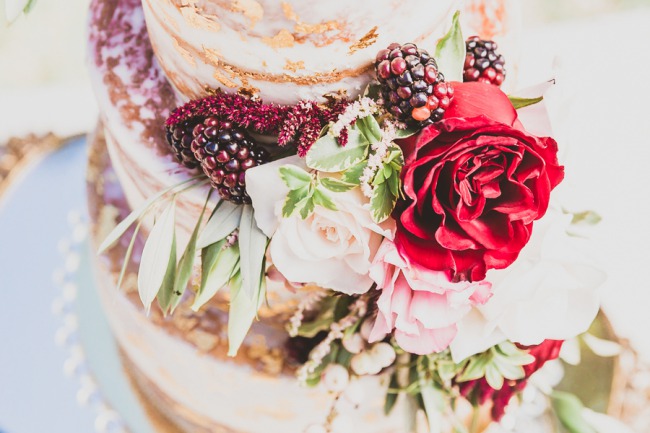 real blackberries and flowers adorn cake
