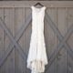dress hanging against gray barn door