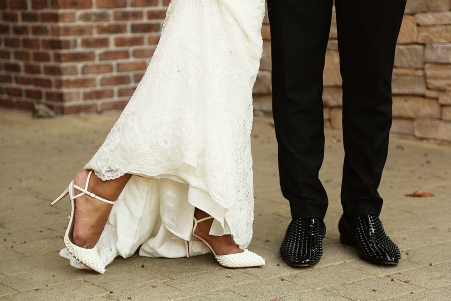 bride and groom wearing matching christian louboutins