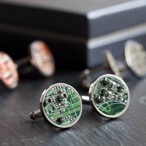 round cufflinks made of green circuit board