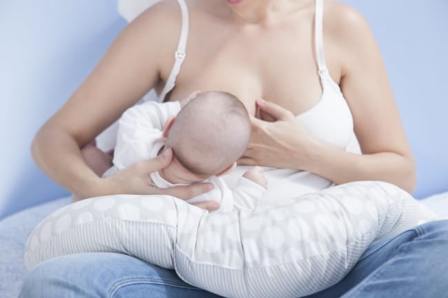 Mother feeding baby nursing bra