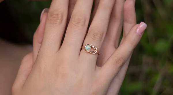 Solitaire Opal Infinity Knot Ring
