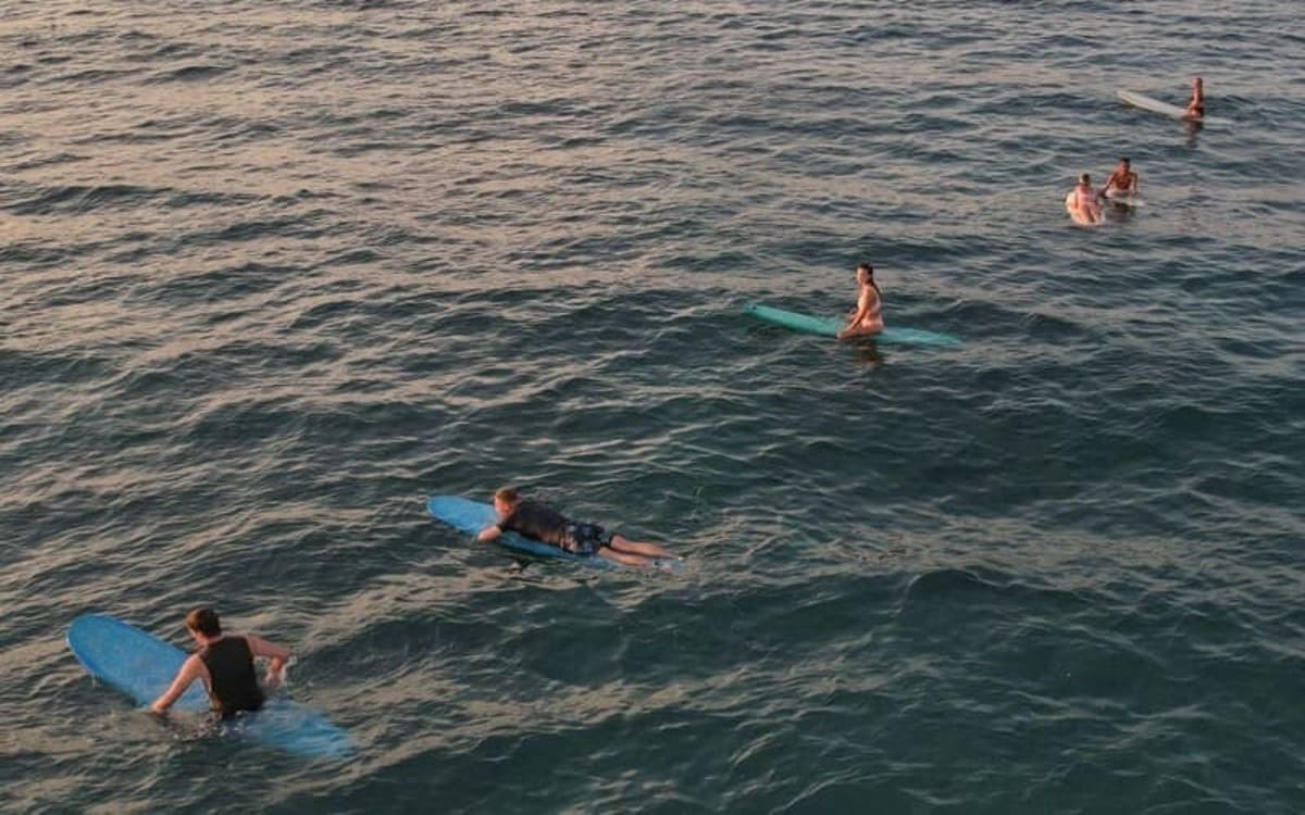 surfers in water drone