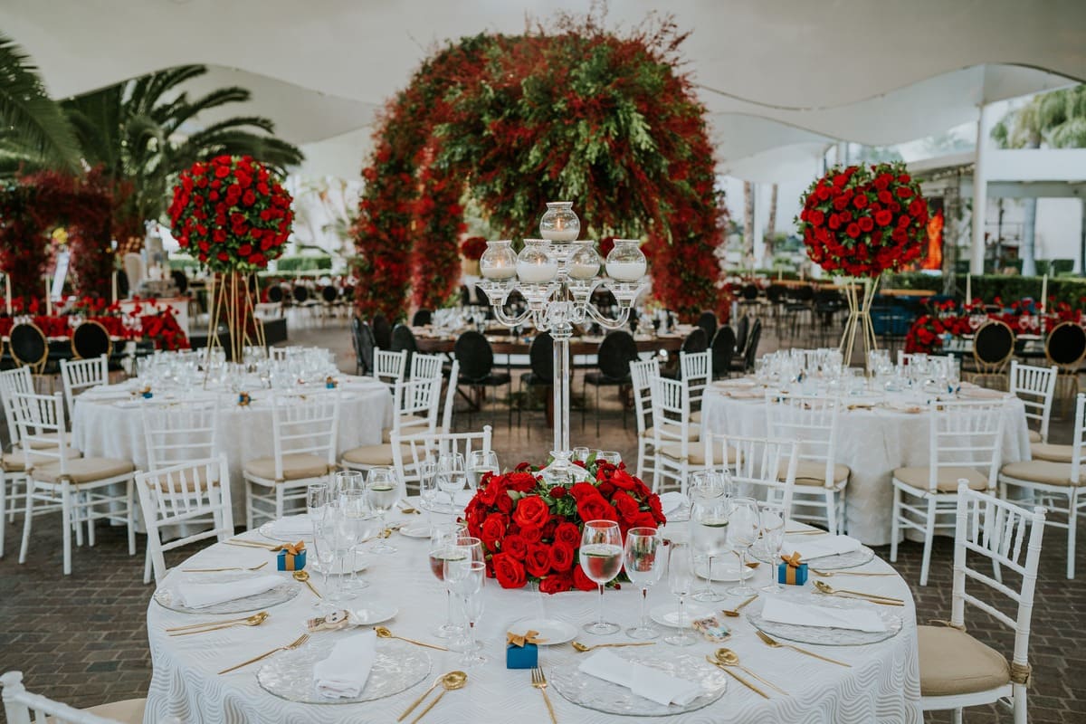 A Table Set Up with Red Roses Flower Arrangement
