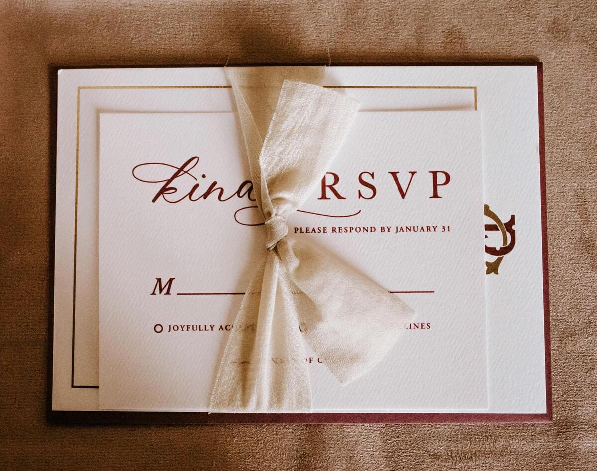 Invitation card with the inscription tied with ribbon